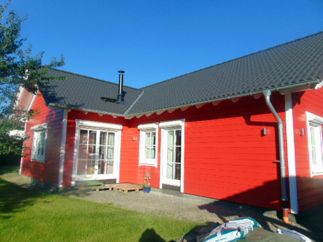 Holzrahmenhaus Winkelbungalow in Rot